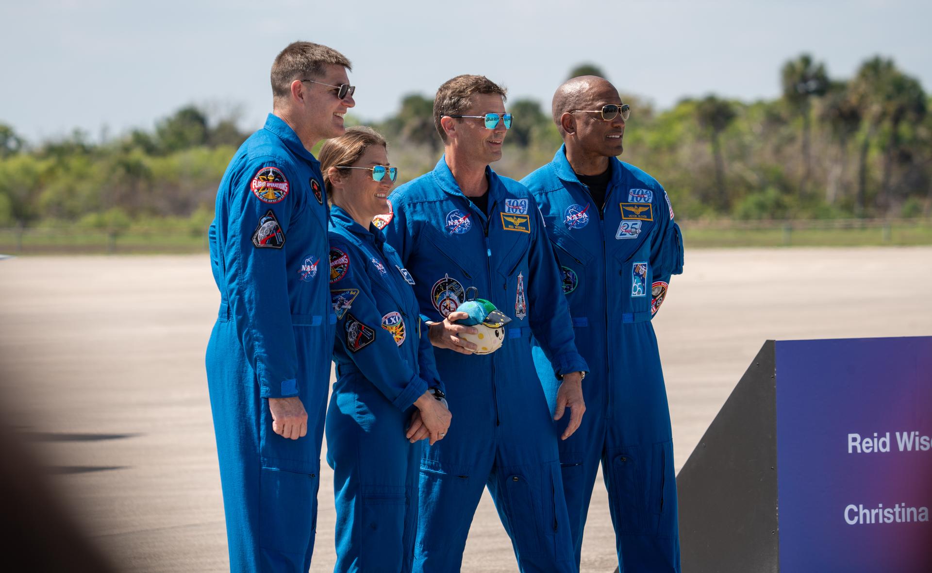 These images show the moments shortly after the arrival of the Artemis II crew to NASA’s Kennedy Space Center on March 27, 2026 ahead of the launch. The four astronauts, Victor Glover, Reid Wiseman, Christina Koch, and Jeremy Hansen, arrived on a T38, which can be seen behind them. They took turns speaking to the crowd as they also announced the zero-gravity indicator they would be taking with them on their journey.